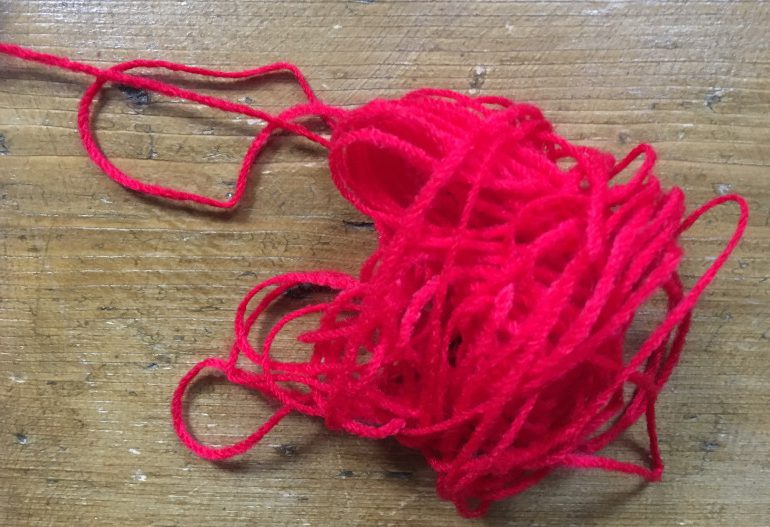 Red yarn by Judy Darley